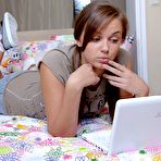 Pic of Hottest Porn watching teenage girl pleasures her very slippery clit by ShavedTeenGirls.com