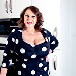 Pic of Naturally big breasted Carol Brown shows off her beautiful dress, and then some... - Free Mature.nl content