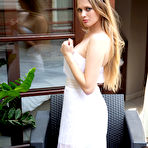 Pic of Sophie Sparks undresses her white dress to show her shaved pussy on the couch