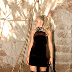 Pic of Blonde dominatrix takes her handsome slave to the ruins for a kinky femdom punishment session