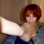 Pic of Beautiful redhead knows how to highlight her goods at HomeMoviesTube.com