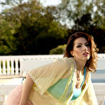 Pic of Wavy-haired beauty with a stunning body shows off by the pool - IamXXX.com