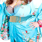 Pic of Fat pornstar Quinn Rain slides her thong aside while playing with her knockers - PORNSTAR.pics