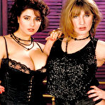 Pic of Busty lesbians have sexual relations in garters and nylons | NakedWomenPhotos.net