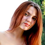 Pic of Cute Redhead Felicia Vina plays with her trimmed pussy on the couch outdoors