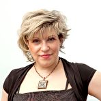 Pic of Mature piano teacher Marianna strips naked and rubs her hairy twat - NakedPics