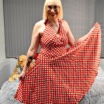 Pic of English Milf wearing a Red Polka Dot Dress takes her knickers half way down and shows off her bald wet cunt &ndash; Bare Milfs