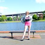 Pic of Mature blonde with long legs wearing a short pink mini skirt flashes her bald pussy in public places &ndash; Bare Milfs