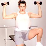 Pic of Brunette MILF Desirae showcases her impressive natural chest while working out intensely | NakedWomenPhotos.net