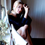Pic of Erotic young Daniel Sea strips at her desk to spread her long legs wide open