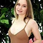 Pic of Teen girl Olivia Myers uncovers her full breasts while disrobing in a solarium