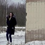 Pic of White girl Vika takes an urgent piss on snow-covered ground next to a building