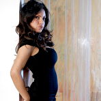 Pic of Latina model with a pretty face Yuri Luv poses non nude in a black dress