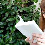 Pic of Japanese teen Yuri reads a book before having sex atop a bed