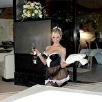 Pic of Blond maid Naughty Julie masturbates her soap covered twat on the side of tub