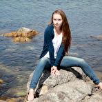 Pic of Skinny girl Milena D sheds jeans on beach to show bald twat underwater