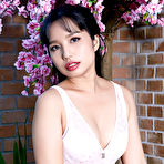 Pic of Dark haired Asian beauty Norah bathes naked in a wooden tub