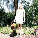 Pic of Solo girl Harley Jade inserting vegetables into pussy in the woods