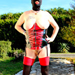 Pic of Amateur chick Mary Bitch sports a ski mask while toying her snatch on a lawn