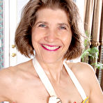Pic of Horny older granny naked in her apron toying with rolling pin in the kitchen