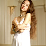 Pic of Slim teen with long legs flashes a no panty upskirt before getting naked