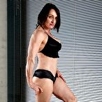 Pic of Female bodybuilder flexes after getting naked on a mat in black socks