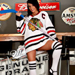 Pic of Amateur girl Nikki Sims covers her naked tits in OTK sport socks