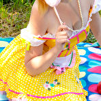 Pic of Adorable teen Alana uncovers her full breasts while going nude near the water