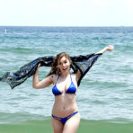 Pic of Beach babe Lena Paul freeing nice melons from bikini by swimming pool