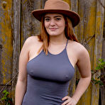 Pic of Sexy clothed Dallin Thorn lifts her tight dress to show her plump round ass