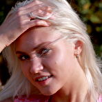 Pic of Young blonde girl Cristina A picks a bunch of wild flowers after getting naked