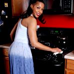 Pic of Older black chick Semmie undressing for nude photo session in kitchen