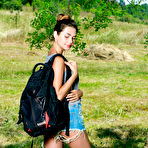 Pic of Adorable teen Georgia undresses for nude poses under a tree in a field
