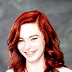 Pic of Petite redhead babe Trinity May having fun with her twat in school