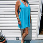 Pic of Mature blonde Ruth frees her tits and ass from a bikini in sunglasses