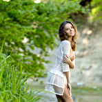 Pic of Thin teen girl with a great smile Clover models naked in a dry river bed
