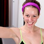Pic of Caucasian girl Candy Smith displays her full bush while working out at home