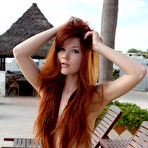 Pic of Redheaded teen girl Mia Sollis poses naked on a poolside deck chair