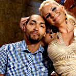 Pic of Dominant blonde Phoenix Marie pegs a submissive male after flogging him