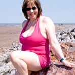Pic of Mature UK plumper Speedy Bee takes off her bikini top during a trip to the sea