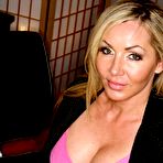 Pic of Big titted sex teacher Lisa DeMarco stripping from silk lingerie