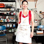 Pic of Mature woman Kali Karinena exposes her tits and ass in her workshop