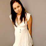 Pic of Latina teen Cindy Cupcakes pulls down her dress to expose her firm boobs