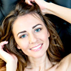 Pic of Naked teen girl wears a smile while showing her bald snatch