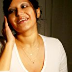 Pic of Pregnant Latina chick licks a nipple during self shot bathroom action