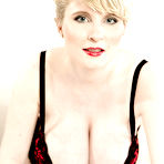 Pic of Pregnant European MILF Casey Deluxe unveiling huge milky boobs in stockings