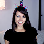 Pic of Nice young girl Andi Land slips a multi-coloured dildo in her shaved pussy