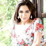 Pic of Busty brunette babe slips off skirt and panties to spread shaved pussy