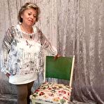 Pic of Big titted oma Caro pulls down her underwear to show her big ass in nylons