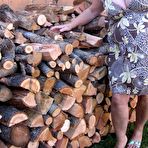 Pic of Brazen older granny strips off by the wood pile to show off BBW tits & big ass